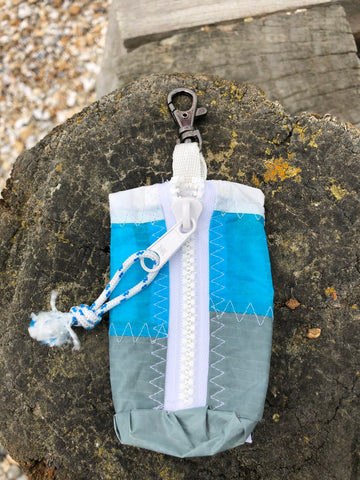 Small handy pouch that fits keys, poop bags and credit cards. Useful for dog walks, going out for a jog, or going to the gym.