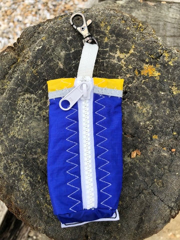 Small handy pouch that fits keys, poop bags and credit cards. Useful for dog walks, going out for a jog, or going to the gym.