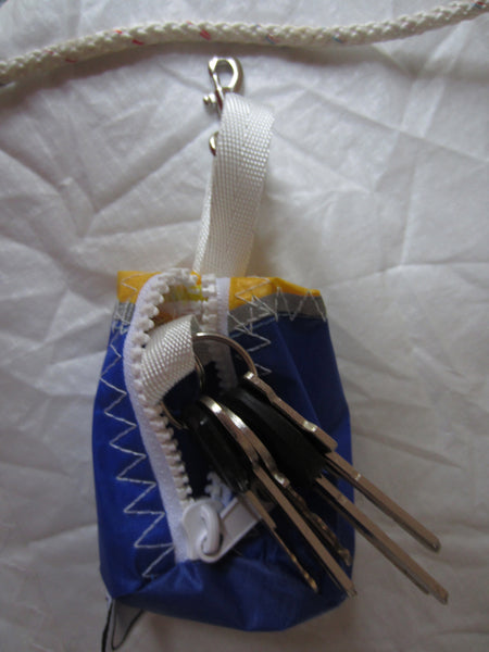 Small handy pouch that fits keys, poop bags and credit cards. Useful for dog walks, going out for a jog, or going to the gym.