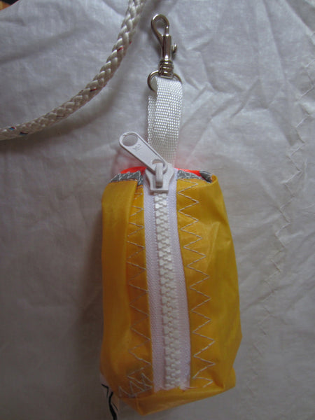 Small handy pouch that fits keys, poop bags and credit cards. Useful for dog walks, going out for a jog, or going to the gym.
