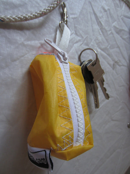Small handy pouch that fits keys, poop bags and credit cards. Useful for dog walks, going out for a jog, or going to the gym.
