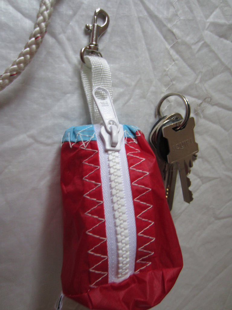 Small handy pouch that fits keys, poop bags and credit cards. Useful for dog walks, going out for a jog, or going to the gym.