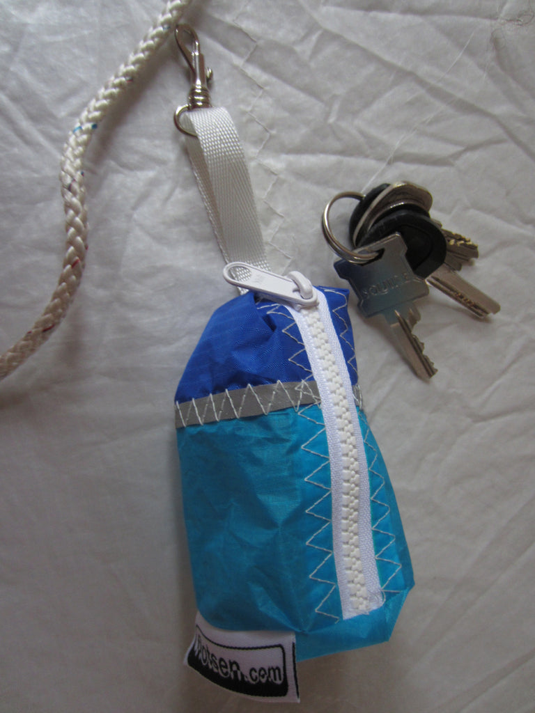 Small handy pouch that fits keys, poop bags and credit cards. Useful for dog walks, going out for a jog, or going to the gym.