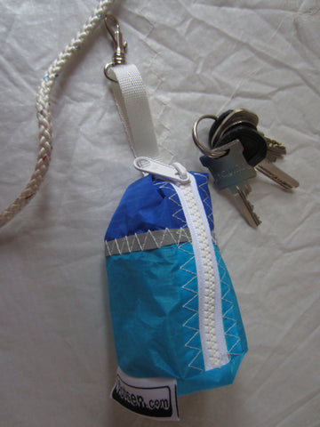 Small handy pouch that fits keys, poop bags and credit cards. Useful for dog walks, going out for a jog, or going to the gym.