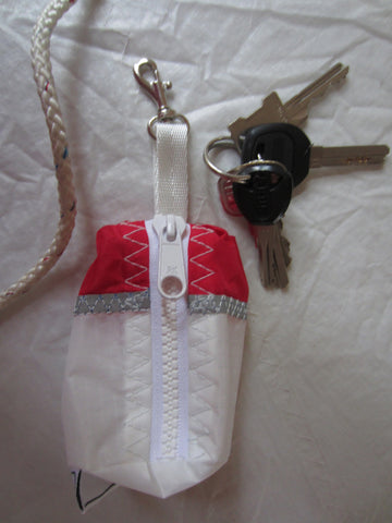 Small handy pouch that fits keys, poop bags and credit cards. Useful for dog walks, going out for a jog, or going to the gym.