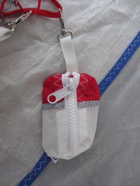 Small handy pouch that fits keys, poop bags and credit cards. Useful for dog walks, going out for a jog, or going to the gym.